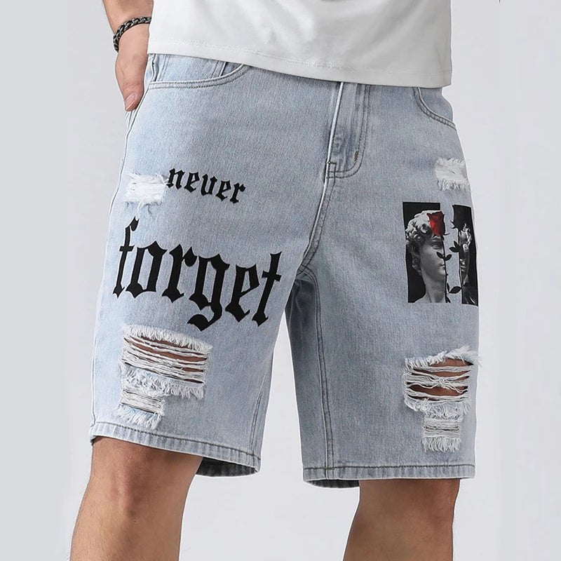 Denim shorts with 'never forget' text and distressed design on a plain background
