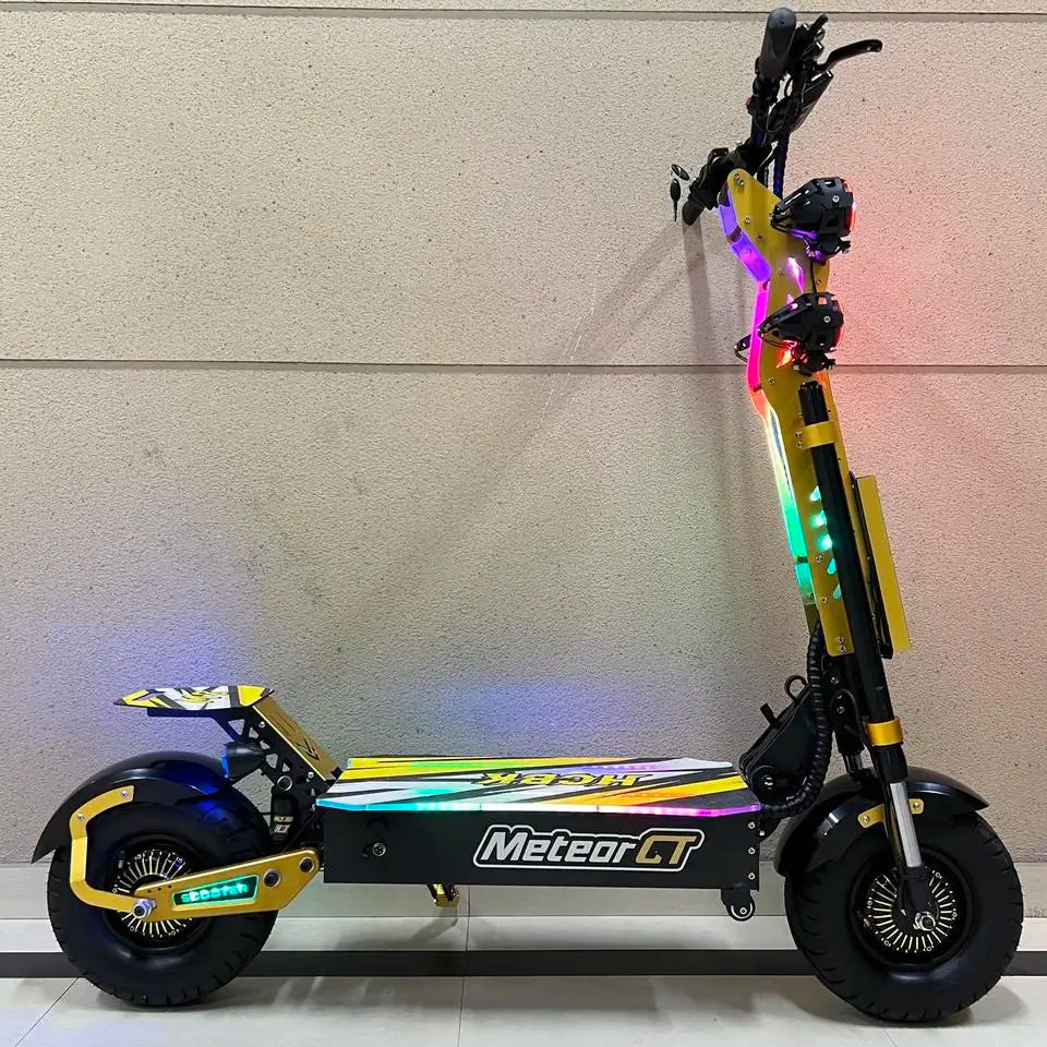 Black and gold electric scooter with colorful lights on a gray background