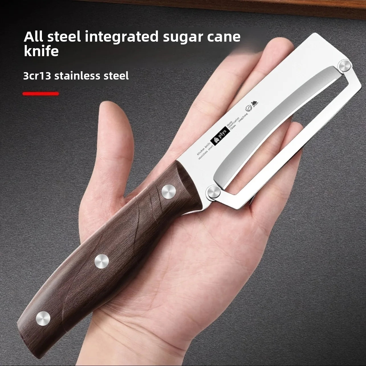 Hand holding a sugar cane knife with wooden handle and stainless steel blade, on a dark background.