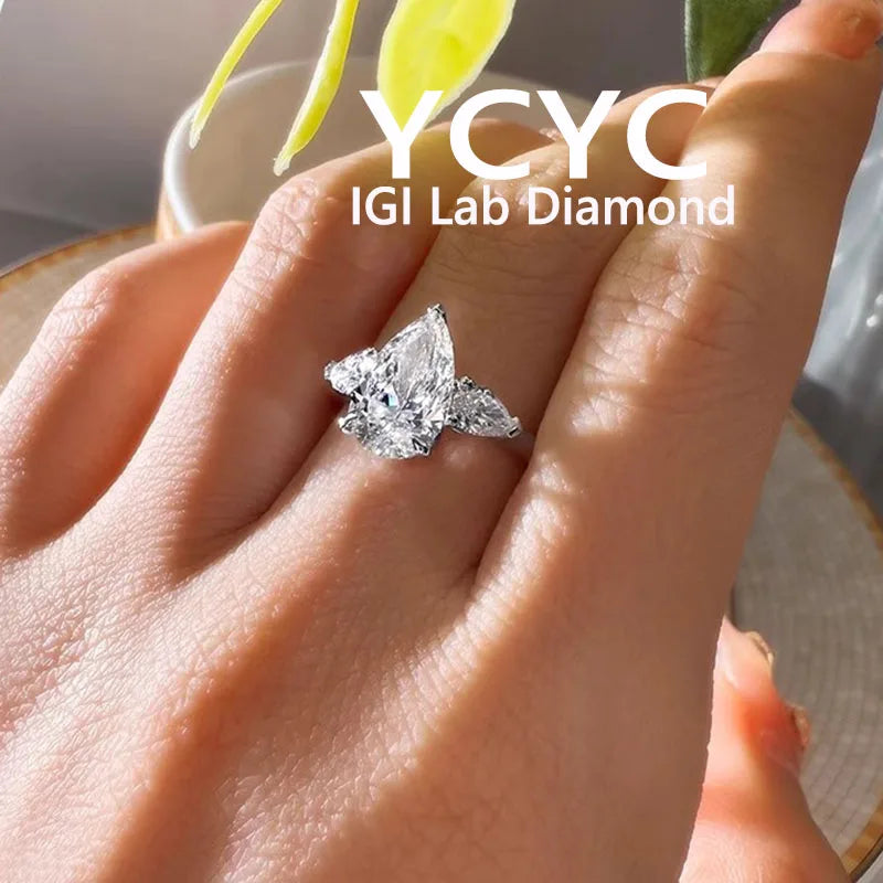 Diamond ring on a hand with 'YCYC IGI Lab Diamond' branding.