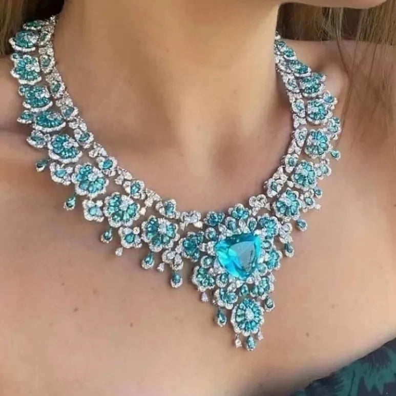 Close-up of a turquoise and silver necklace on a person