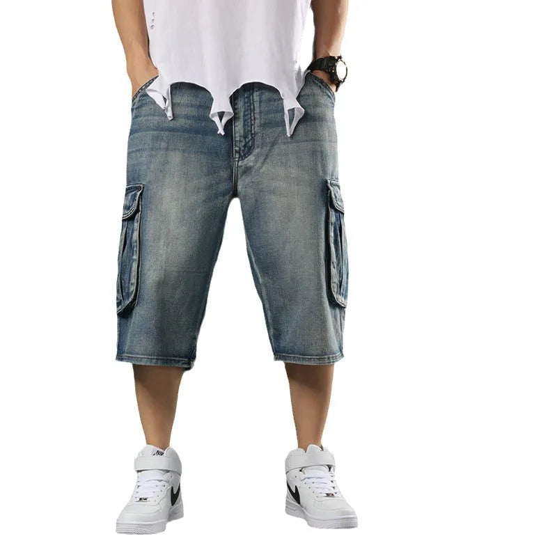 Denim shorts with multiple pockets worn by a person on a white background