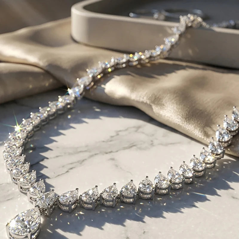 Diamond necklace on a marble surface with a beige fabric background