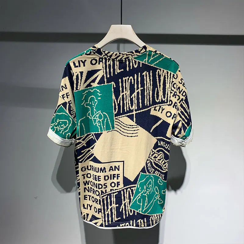 Short-sleeve shirt with graphic design on a hanger against a gray background