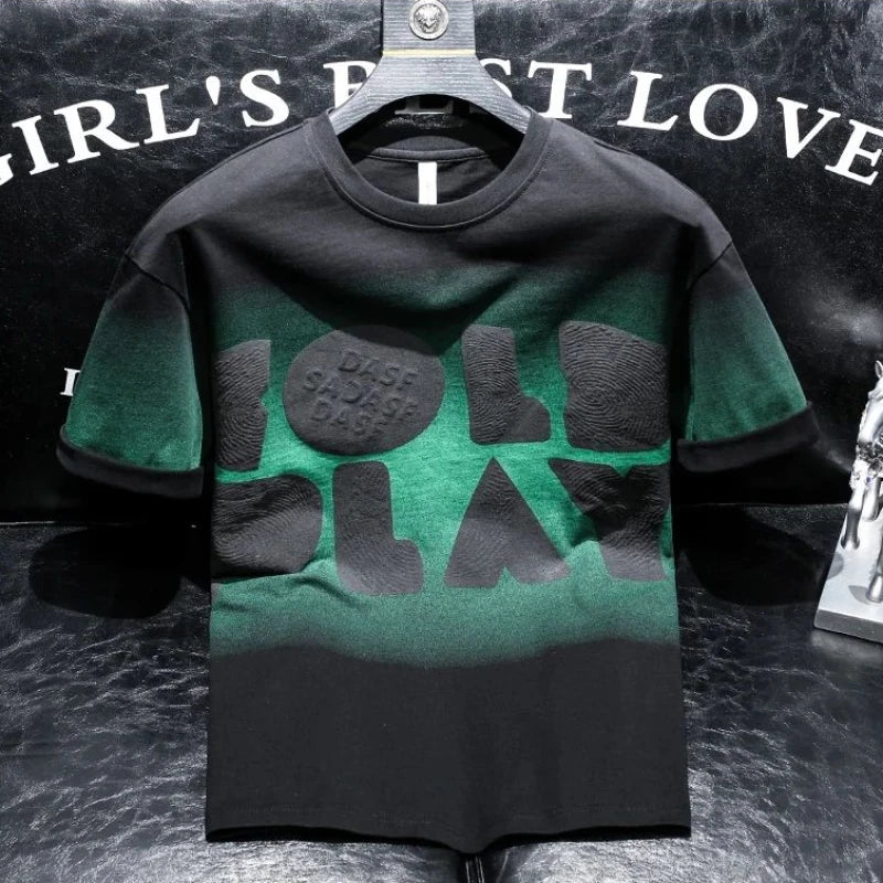 Green and black t-shirt with text on a dark background