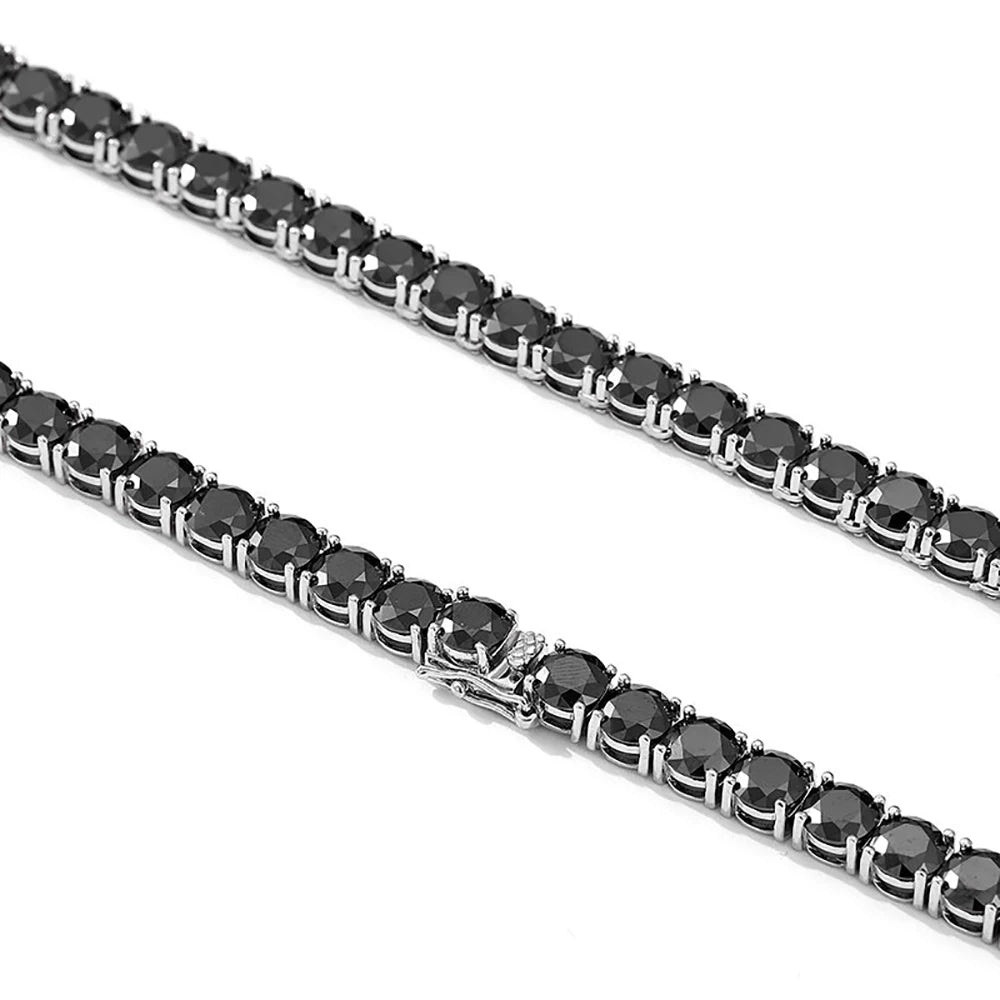 Two black diamond tennis bracelets on a white background