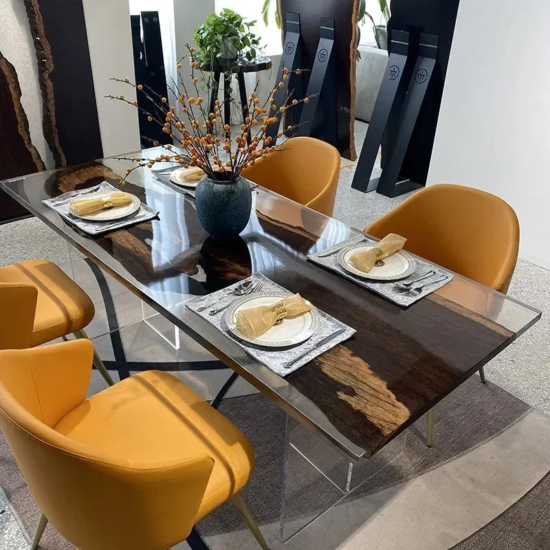 Dining table set with plates, napkins, and a vase in a modern interior setting.