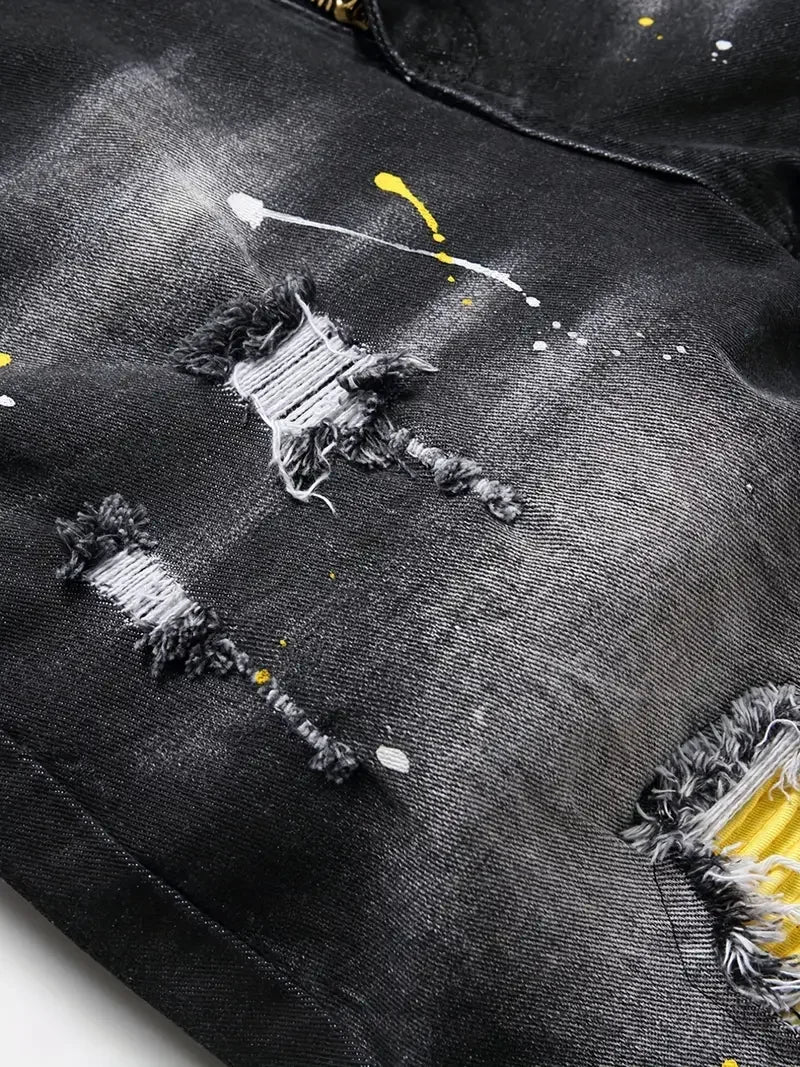 Black distressed denim jacket with visible wear and tear.