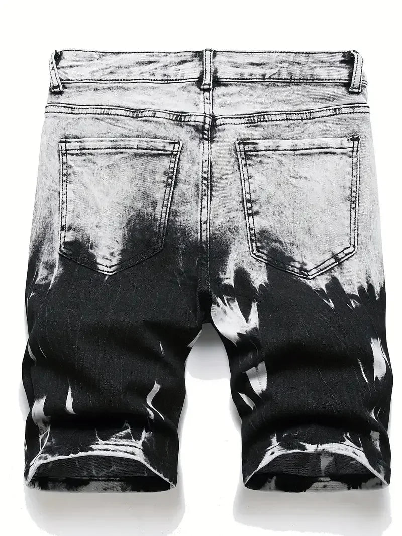 Black and white distressed denim shorts on a white background