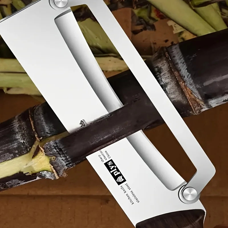 Manual sugar cane cutter with a white handle and black blade on a background of sugarcane.