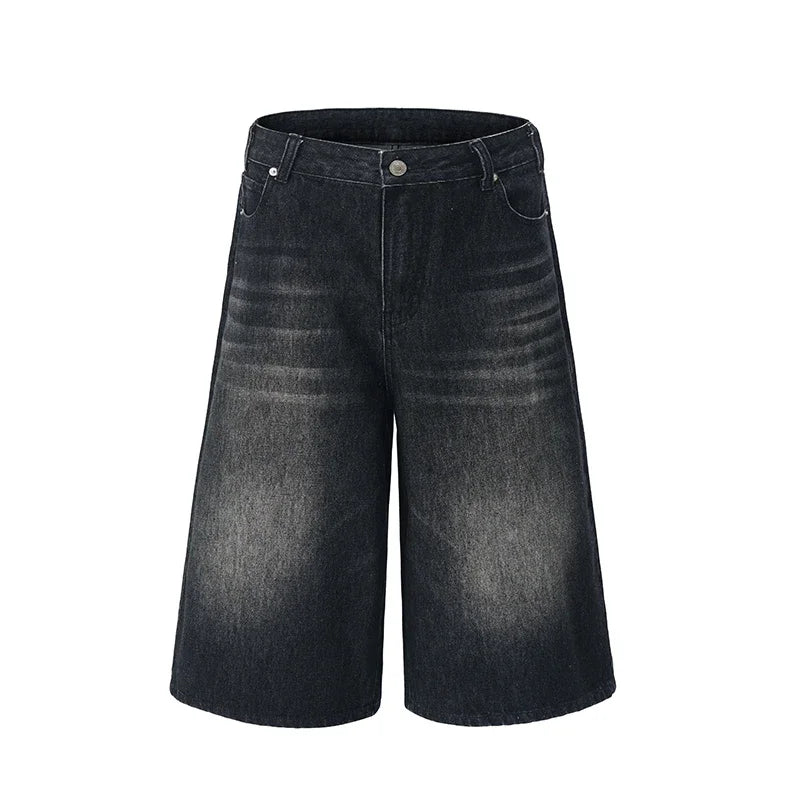 Black denim shorts on a white background