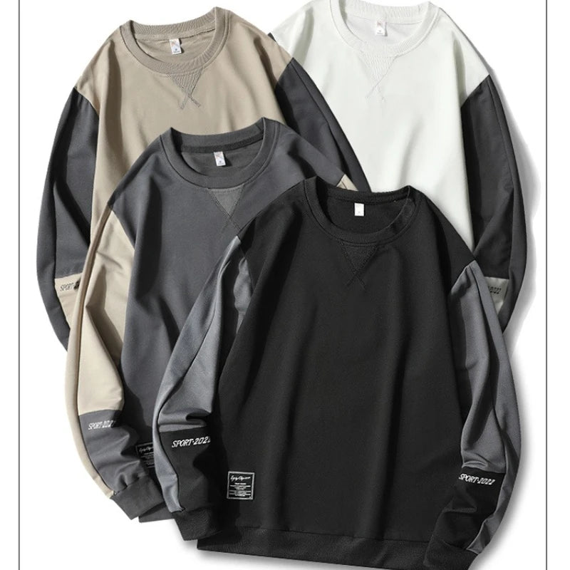 Four sweatshirts in different colors on a white background