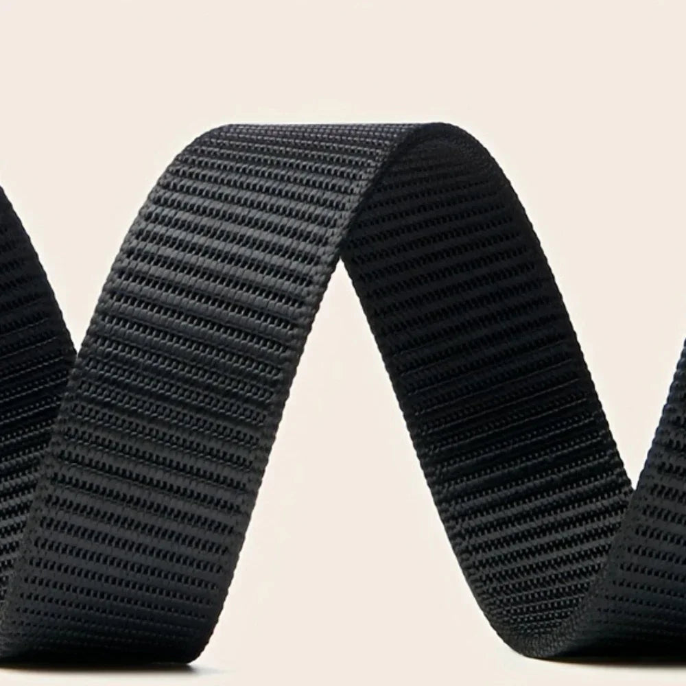 Close-up of a black webbing strap on a beige background