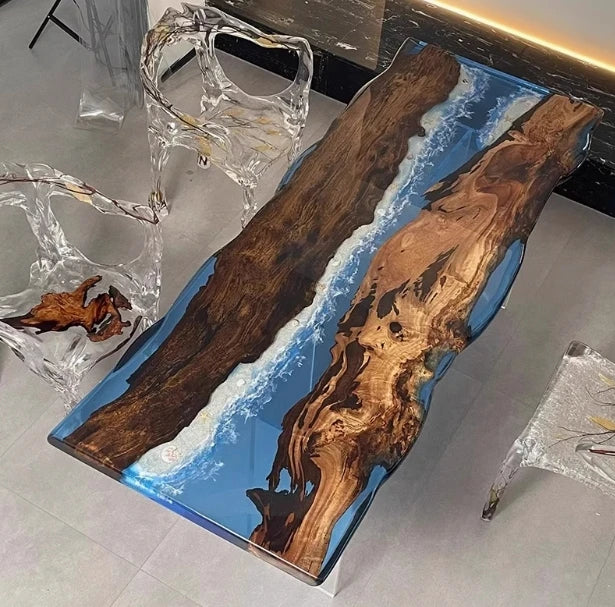 Wooden table with blue resin inlay on a gray floor
