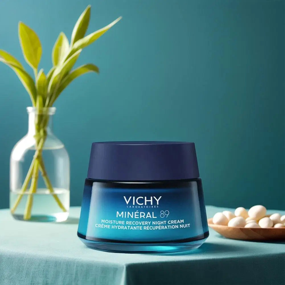 Vichy Mineral 89 cream jar on a teal surface with a plant and bowl of eggs in the background