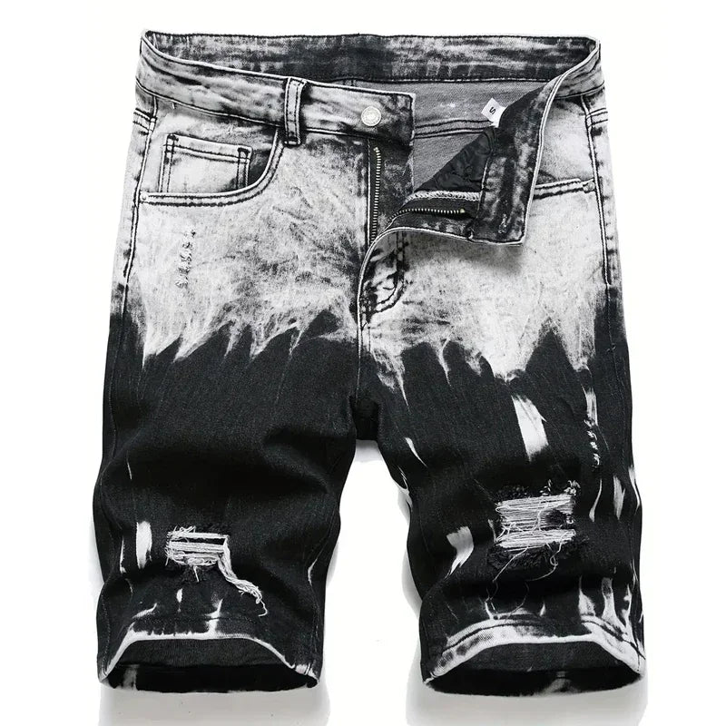 Black and white distressed denim shorts on a white background