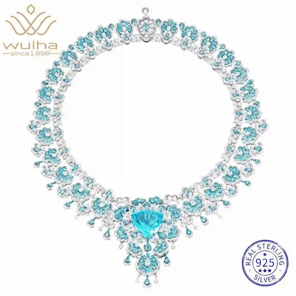 Luxury necklace with blue gemstones and 'wuha' branding on a white background