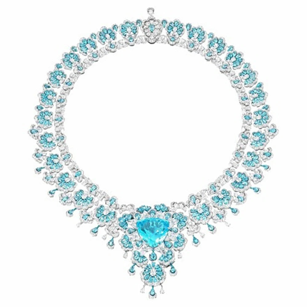 Luxury diamond necklace with blue gemstones on a white background
