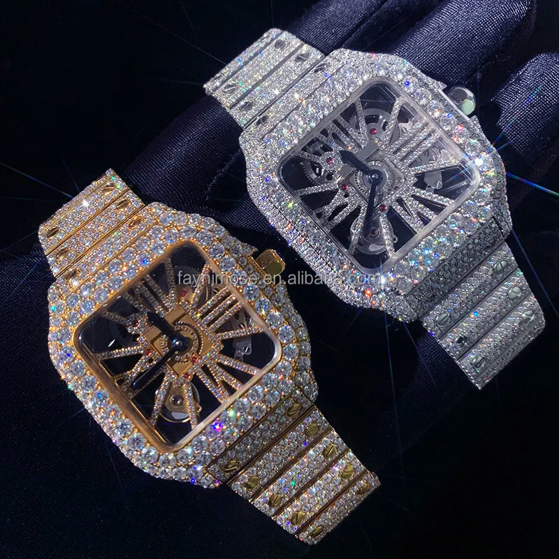 Two ornate watches, one gold and one silver, on a dark background.