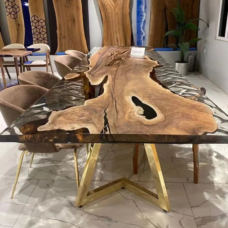 Wooden dining table with gold legs in a modern interior setting