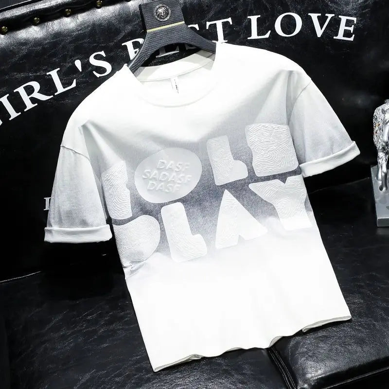 White t-shirt with black text and graphics on a dark background