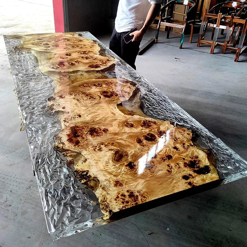 Long wooden table with a glass-like finish in an indoor setting