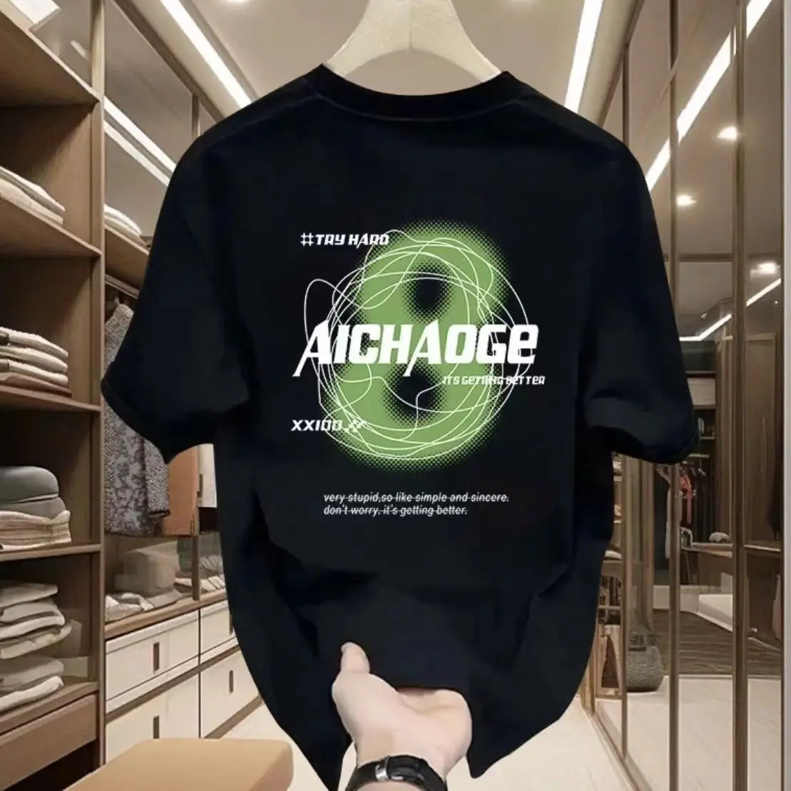 Black sweatshirt with green and white graphics and text, held up in a room.