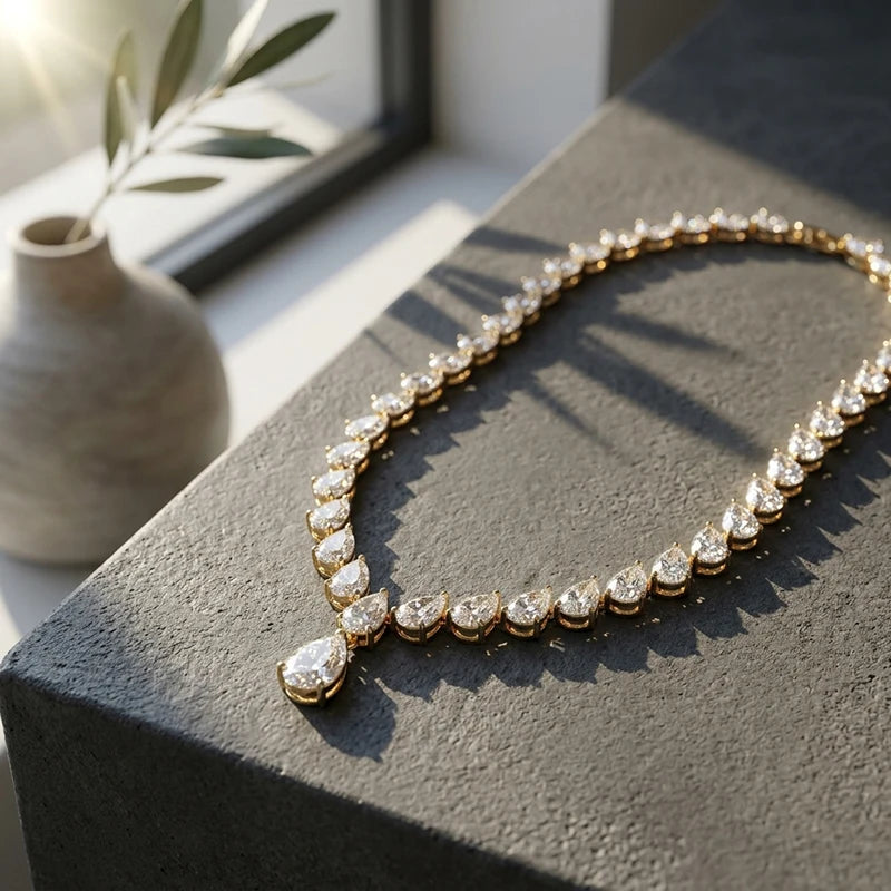 Diamond necklace on a dark surface with a blurred indoor background