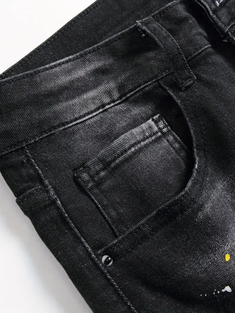 Close-up of black jeans with a brand logo on a white background