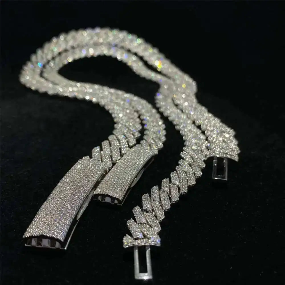 Silver chain necklace with diamond-like stones on a black background