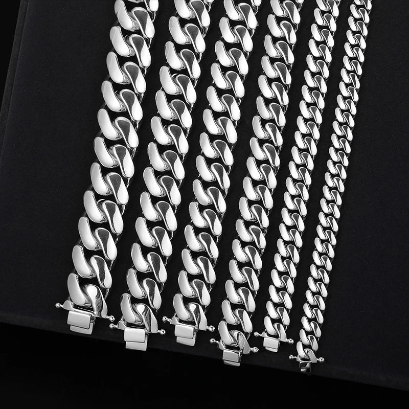 Silver chain necklace on a black background