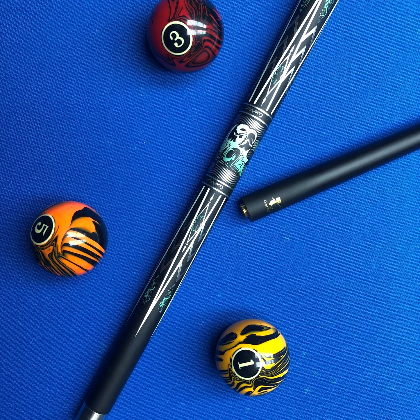 Pool cue with three pool balls on a blue background