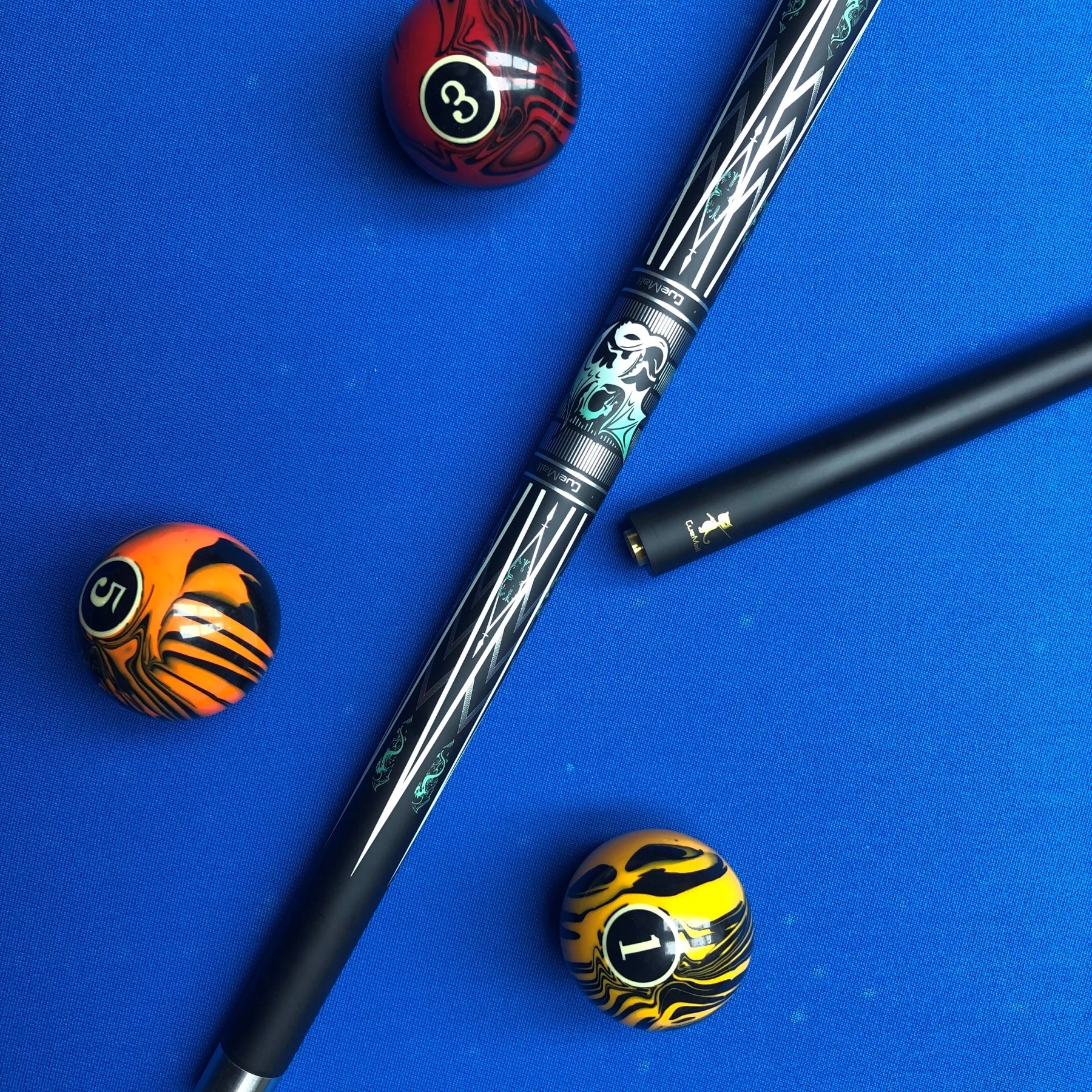 Pool cue with three pool balls on a blue background