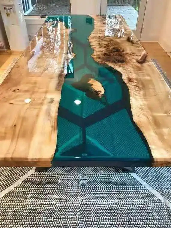 Wooden table with a teal resin inlay in a room setting