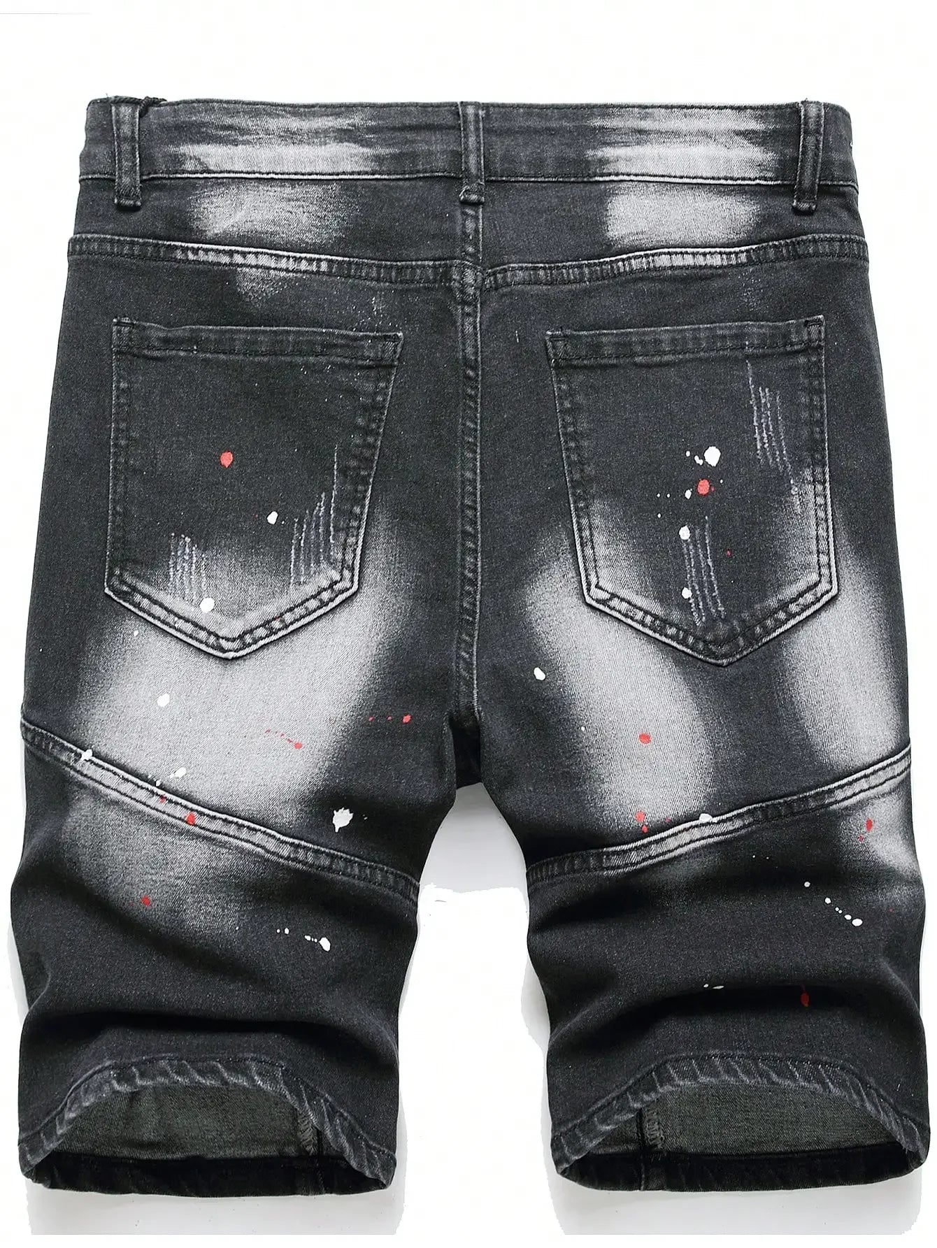 Black denim shorts with paint splatter design on a white background