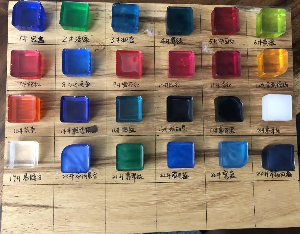 Color swatches arranged in a grid on a wooden surface