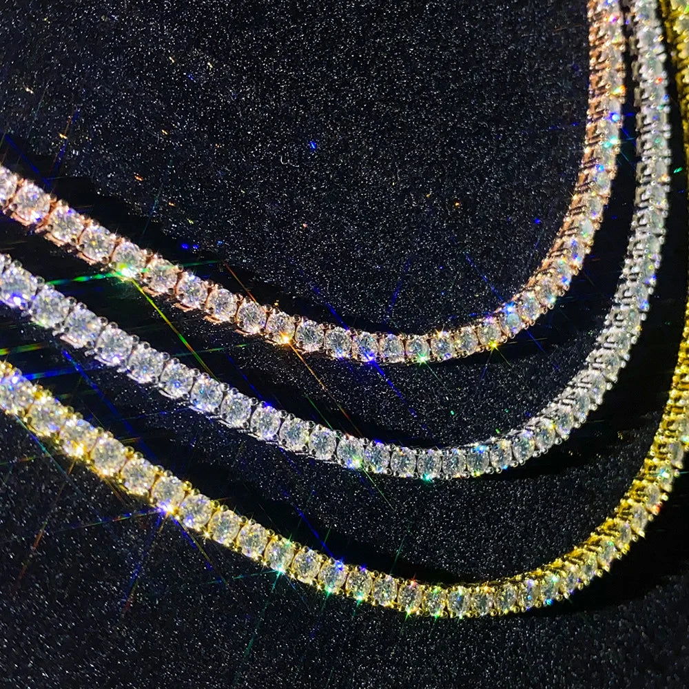 Close-up of a row of clear rhinestone chains on a black background