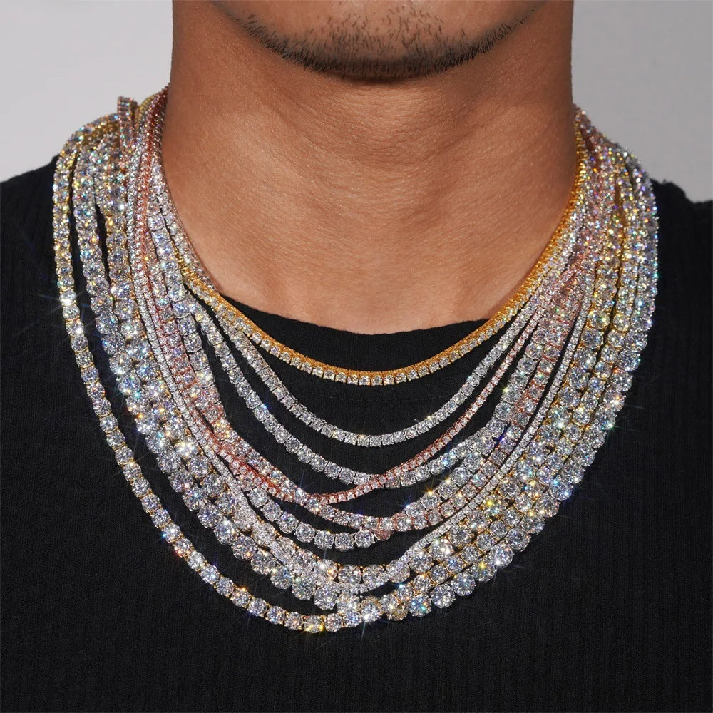 Multiple diamond necklaces on a person's neck against a neutral background