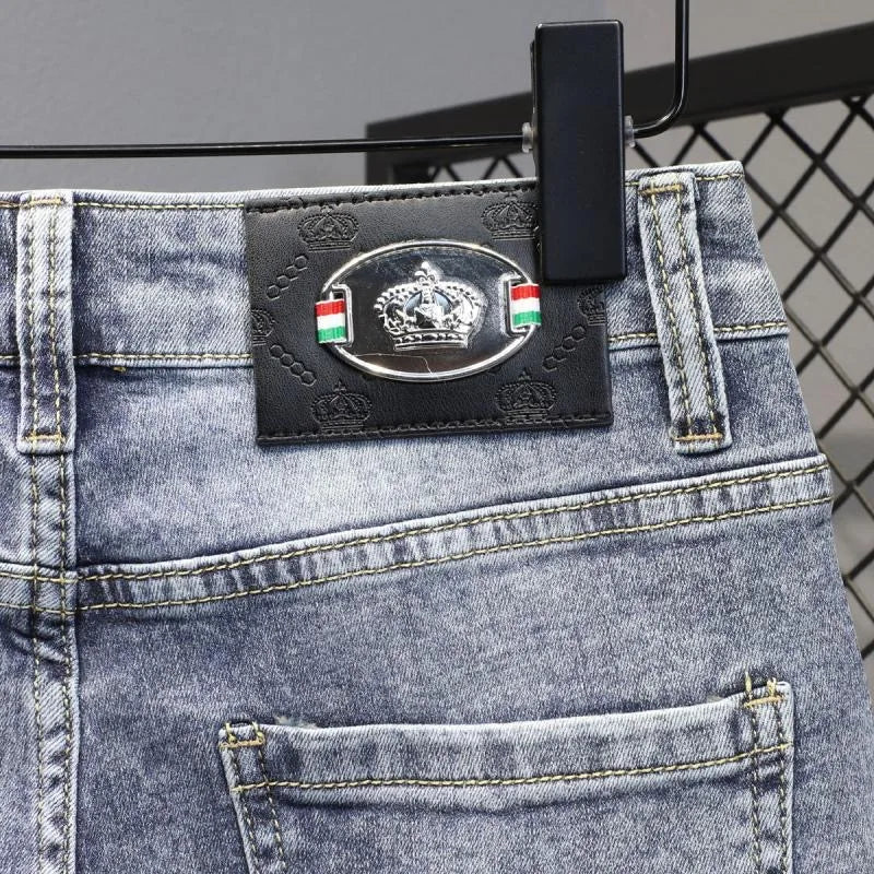 Close-up of a denim product with a brand label on a gray background