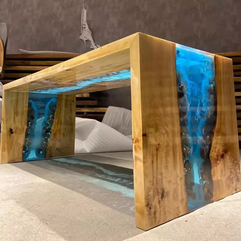 Wooden table with blue resin inlay in a living room setting