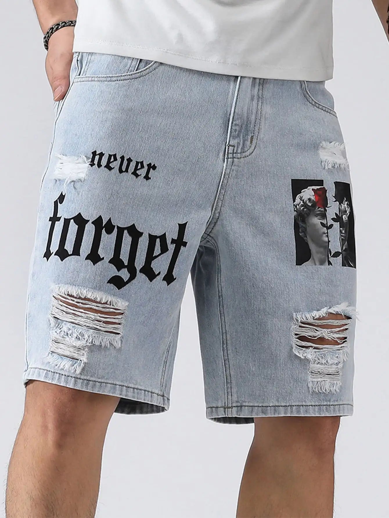 Denim shorts with 'never forget' text and a patch on a white background